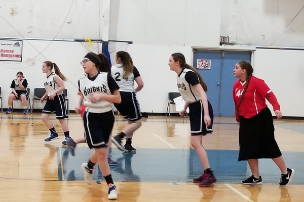 Girls running during basketball game